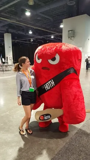 Woman with a big red mascot