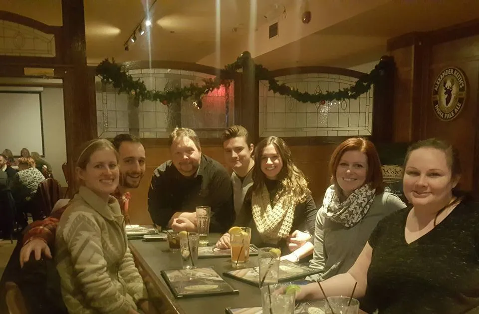 Vonclaro staff at a restaurant for holiday celebration dinner discussing career opportunities for the new year. 