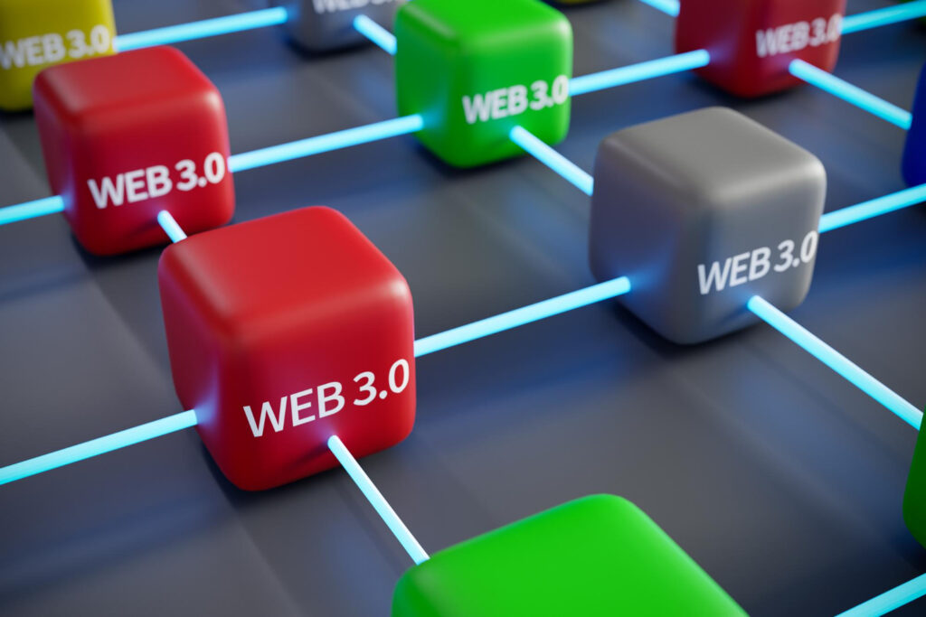 Fictional mockup of red, green and grey cubes, connecting by a light blue laser, the cubes say Web 3.0 and this illustrates Core Web Vitals optimization benefits.