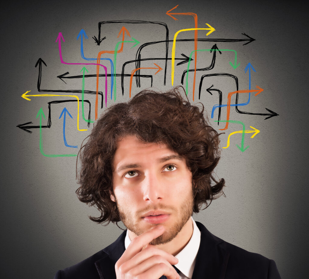 Man with a questioning expression surrounded by colorful arrows, contemplating strategies using a Digital Marketing Dashboard.