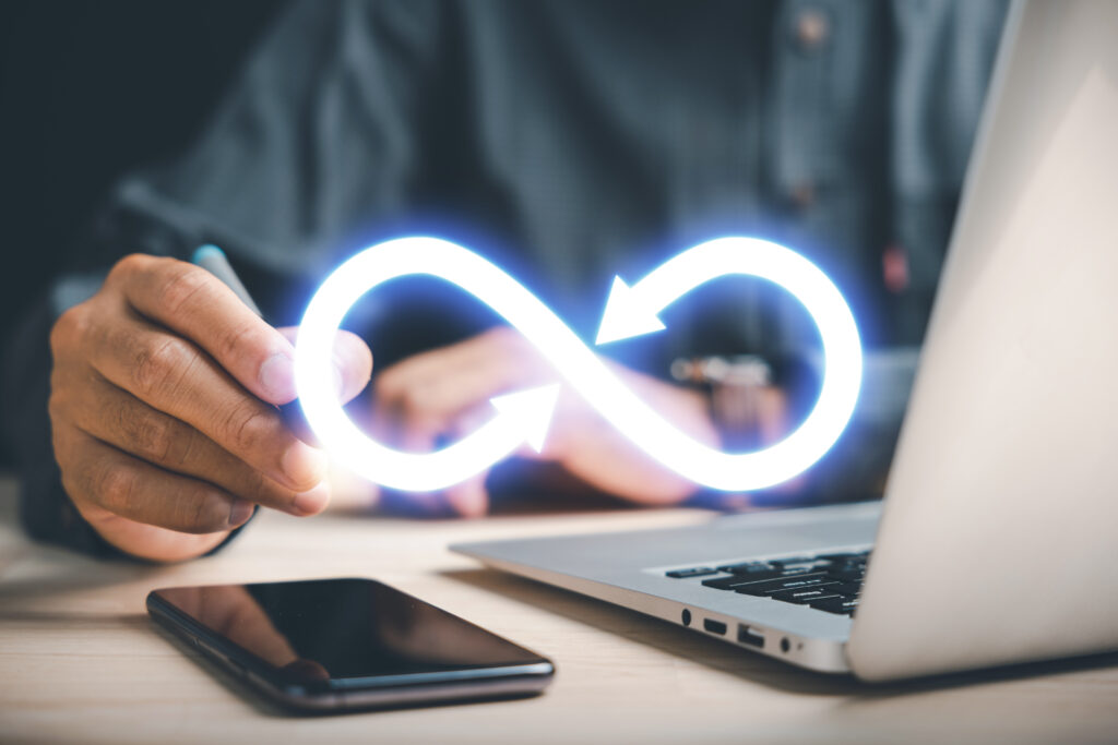 Businessman points to infinity symbol, representing limitless connection in data technology. UTM link builder.