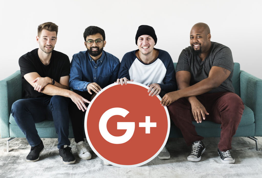 A group of four diverse people holding a large Google Plus icon, illustrating the importance of tracking template Google Ads in collaborative digital marketing efforts.